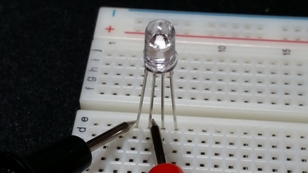 With the red probe on the common, the RGB LED doesn't light up because it is common cathode